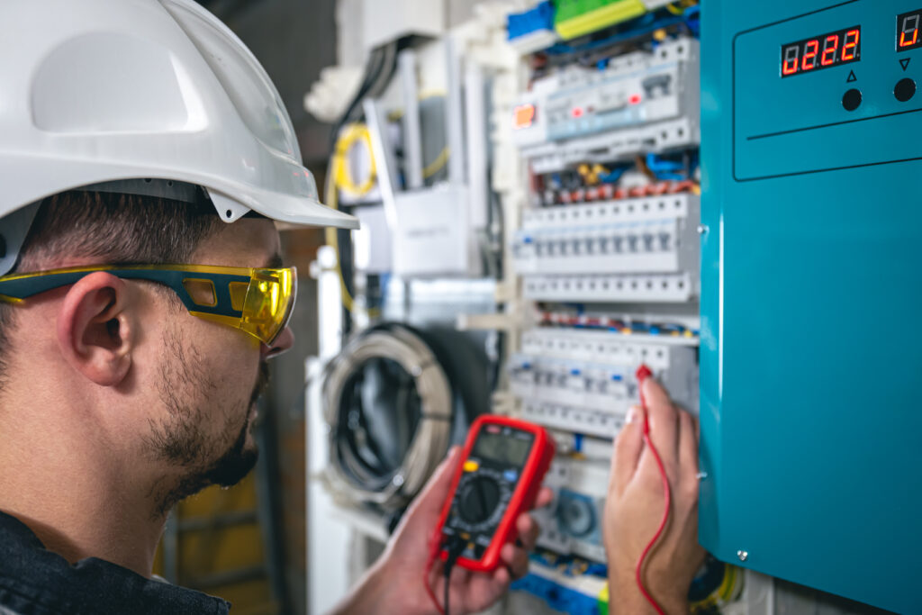 electrical inspecting a switchboard with fuses